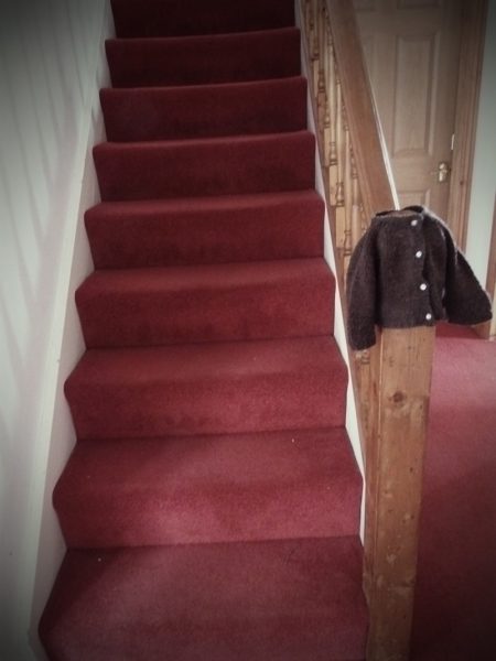brown cardigan stairs